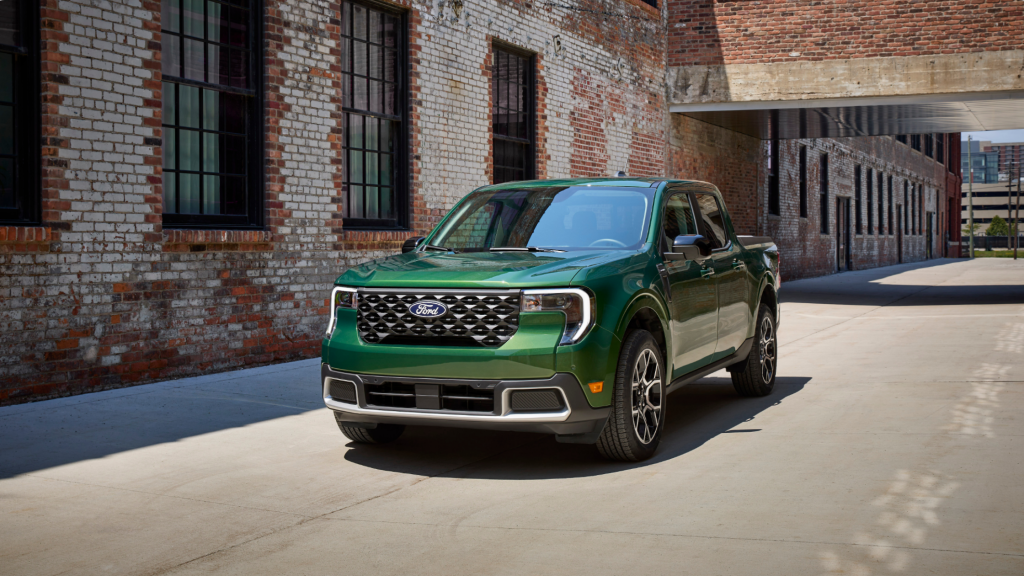 2025 Ford Maverick® pickup in green, parked in an urban alley highlighting compact truck design.