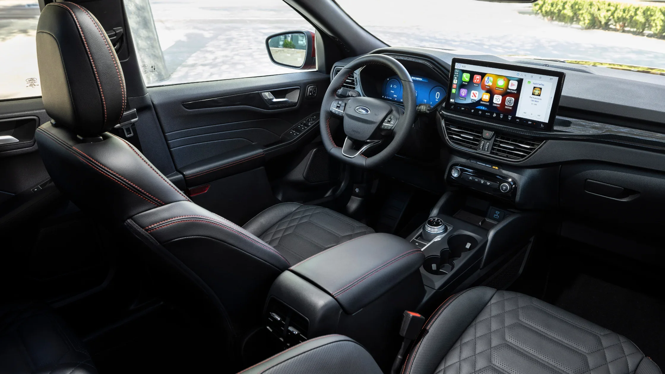 2025 Ford Escape® ST-Line Hybrid interior cockpit view featuring digital cluster and large center touchscreen with Apple CarPlay