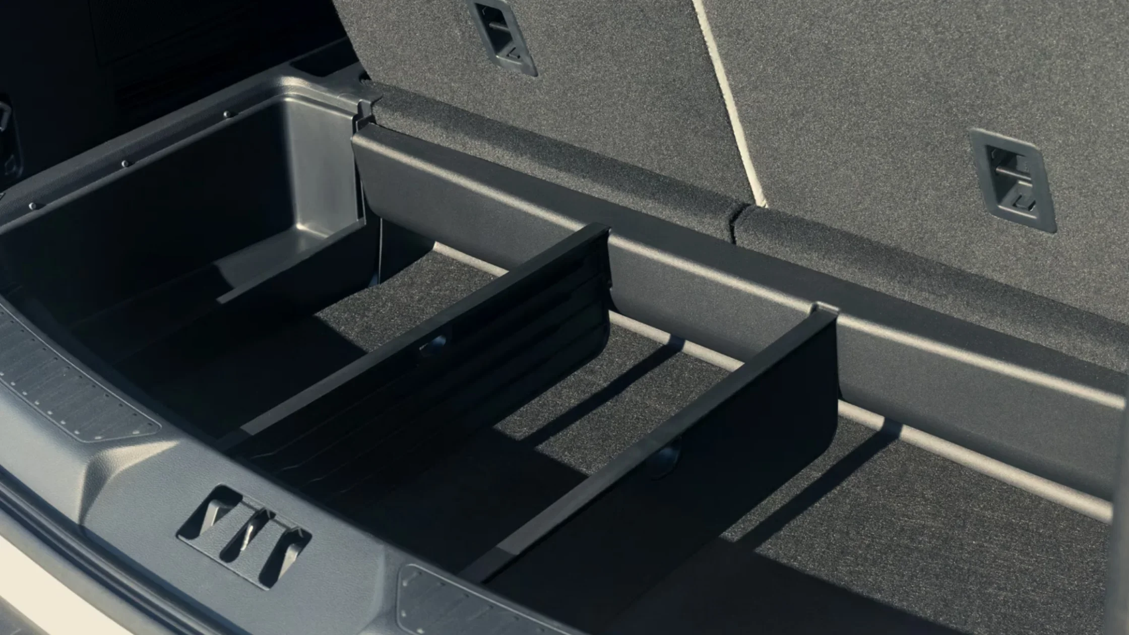 2025 Explorer® rear cargo storage with adjustable divider system for organized packing.