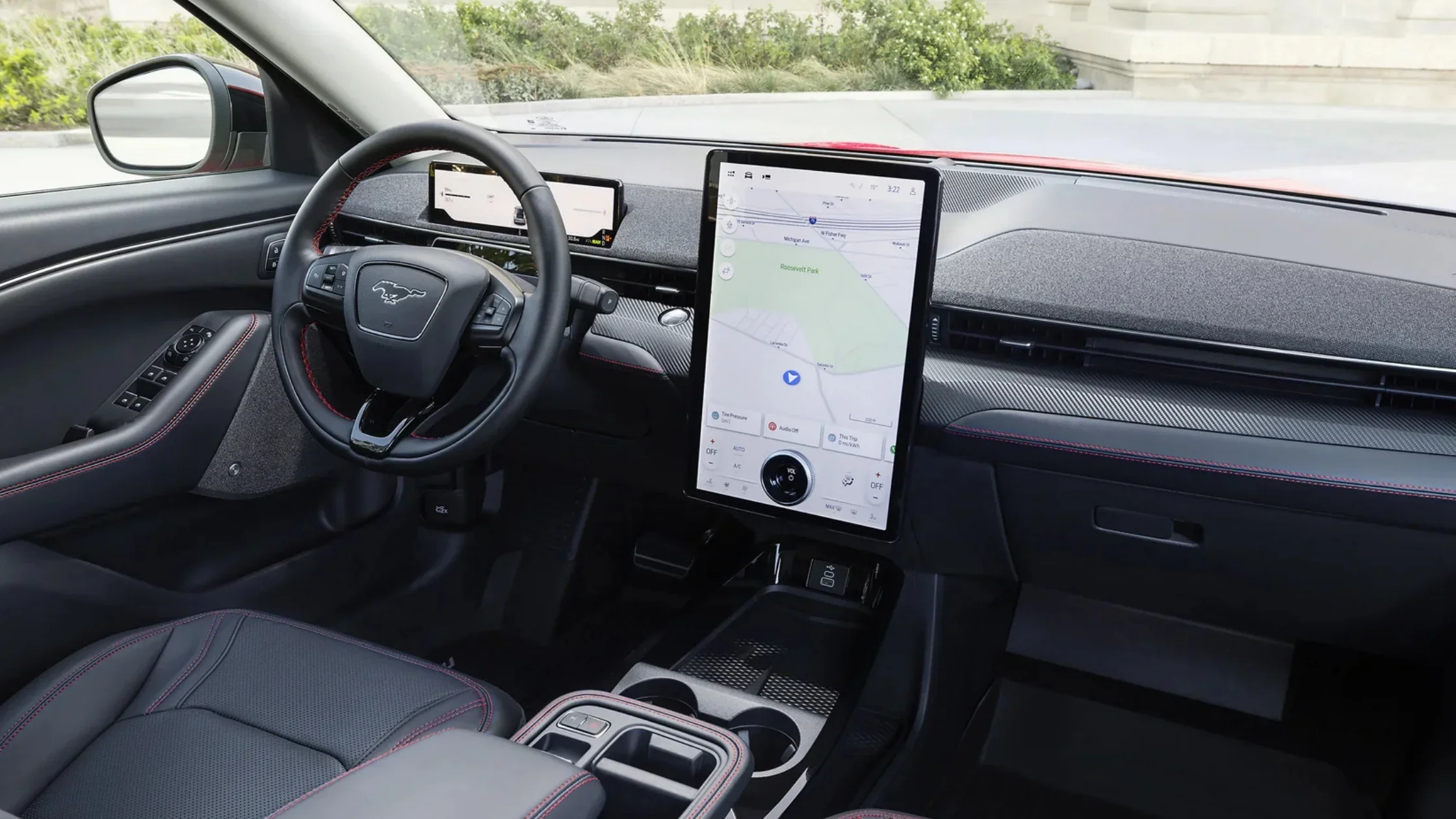 2025 Mustang Mach-E® interior featuring SYNC® touchscreen and red-stitch leather steering wheel