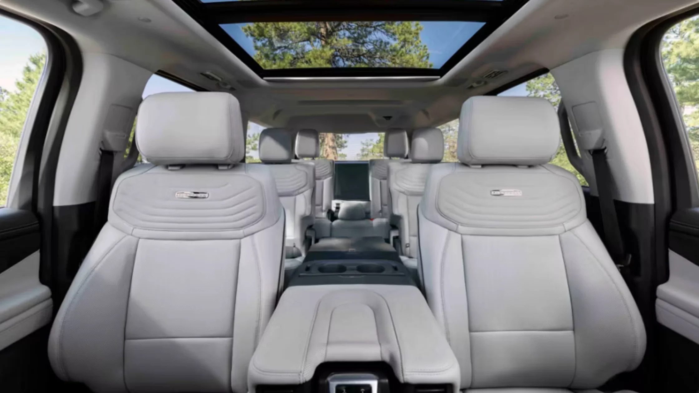 Spacious 2025 Ford Expedition® interior with three-row leather seats and panoramic sunroof.